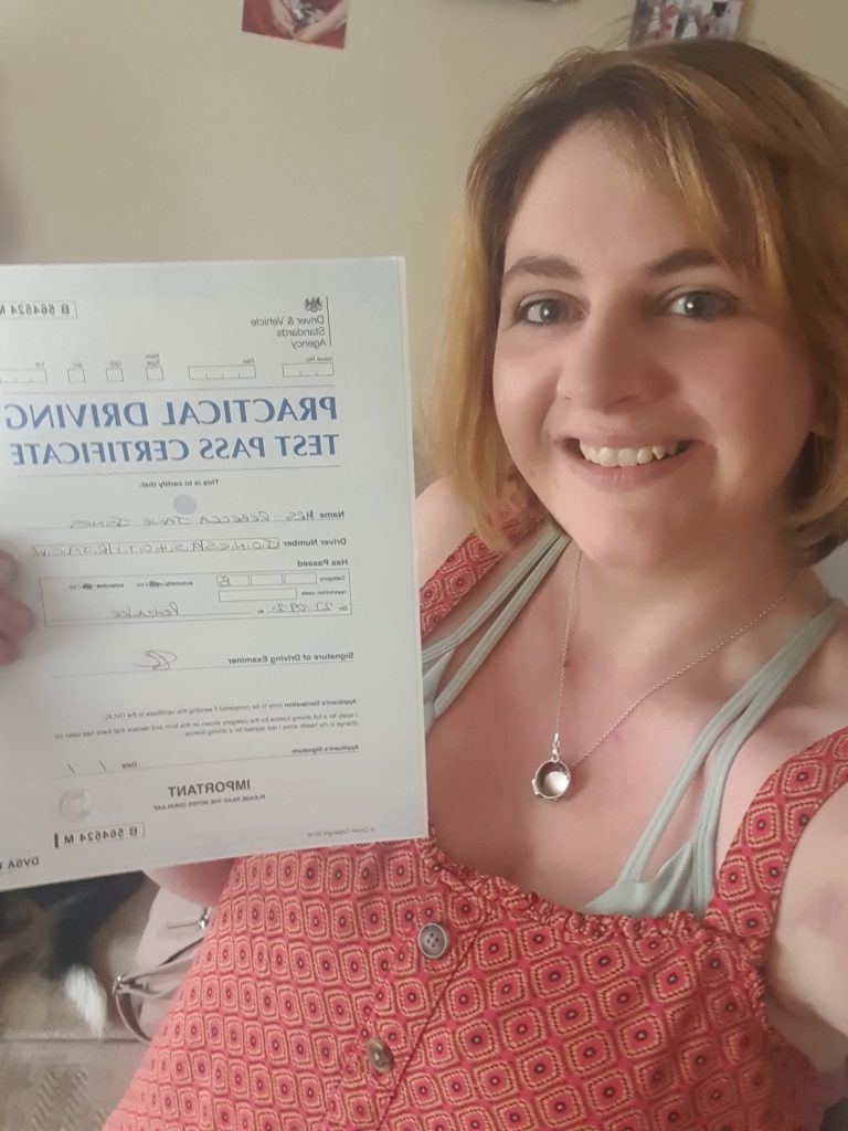 Becky with her driving test pass certificate