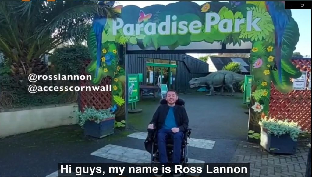 First frame of Ross Lannon's video review of Paradise Park, with Ross, in his wheelchair, under the Entrance arch.
