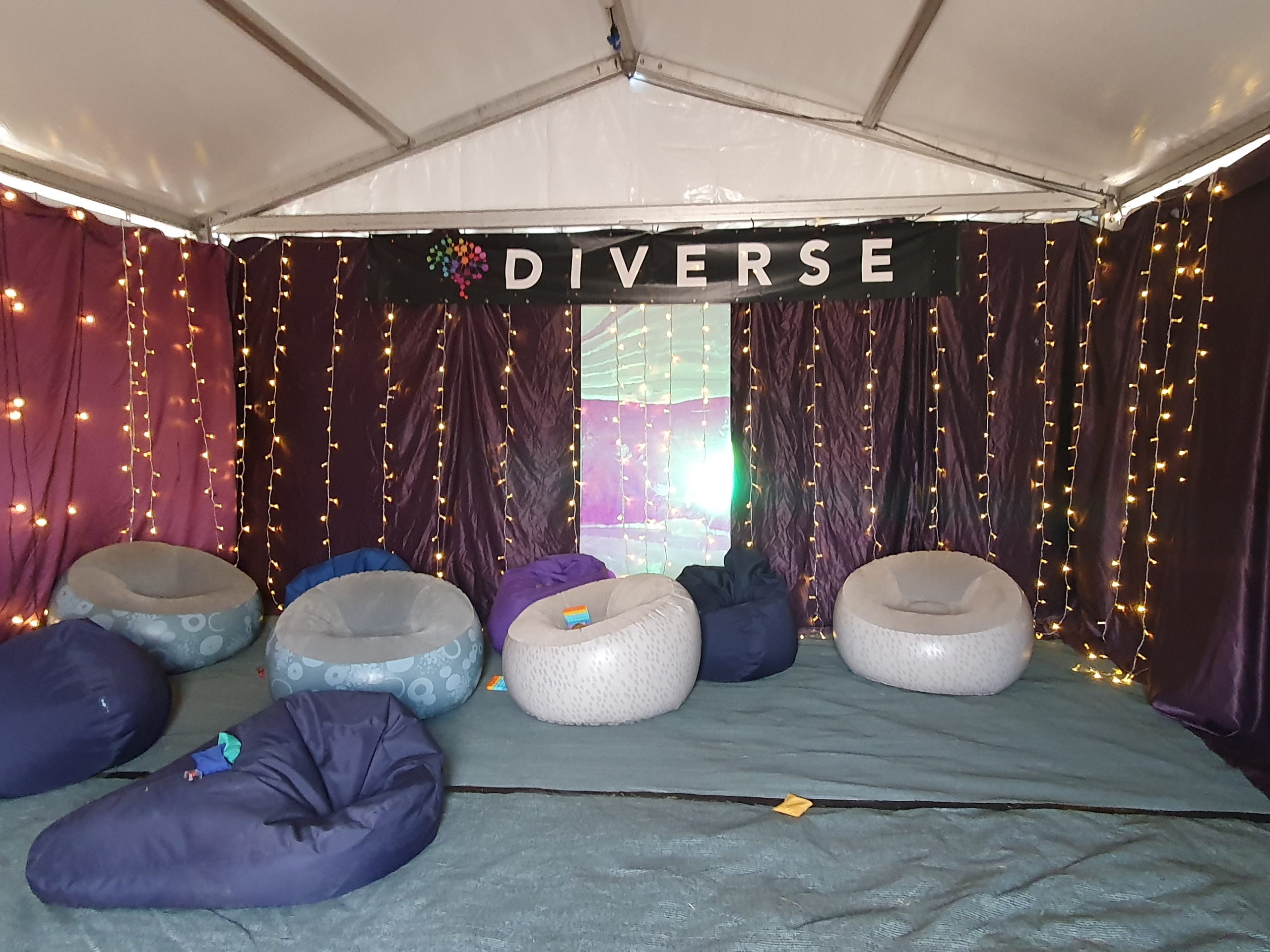 The Inside of the sensory calm space. 10 large beanbags accompanied by soft fairy lights hanging from the walls 