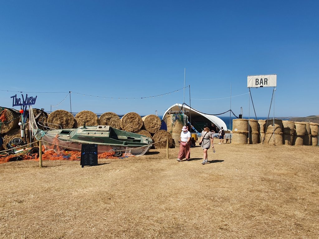 just outside the view stage, showing boat display, sign and hay bale walls