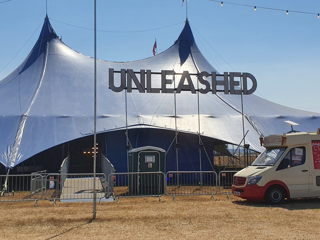 outside unleashed stage, full tent view along with wheelchair access ramp and accessible toilet