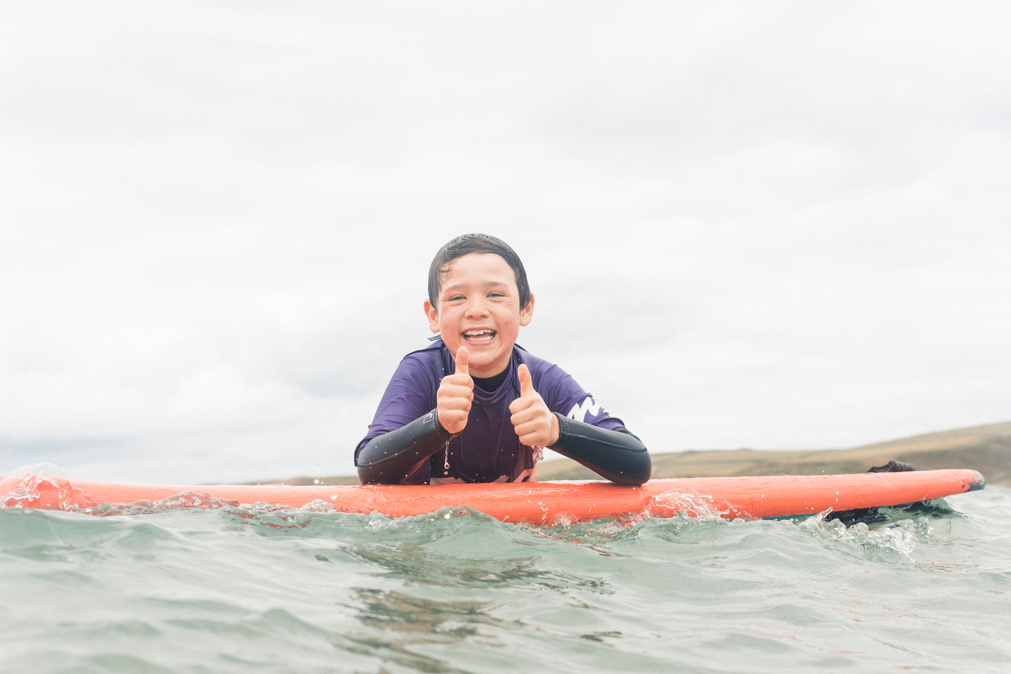 A young child enjoying a watersports session with WaveHunters