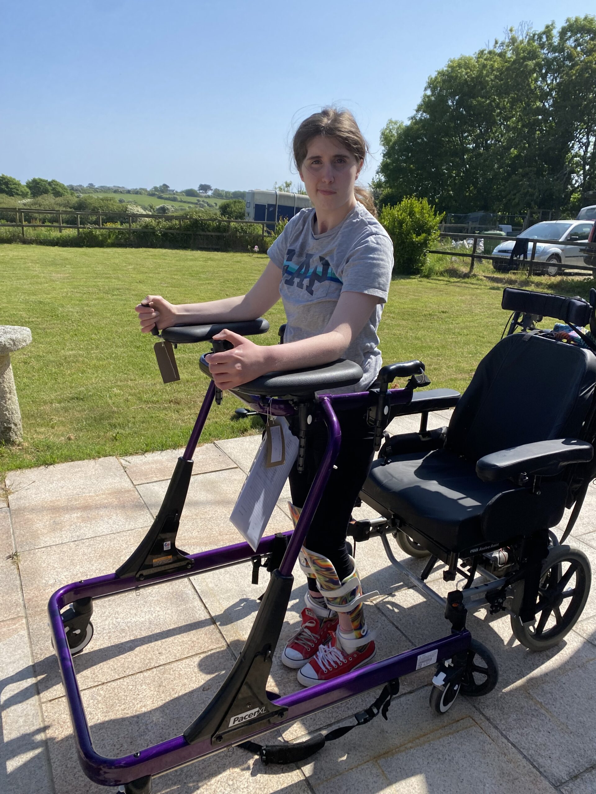 Holly Standing up from her wheelchair using a a pretty swish standing frame