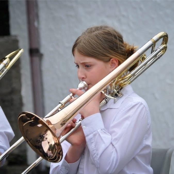 Holly playing the trombone when she was younger