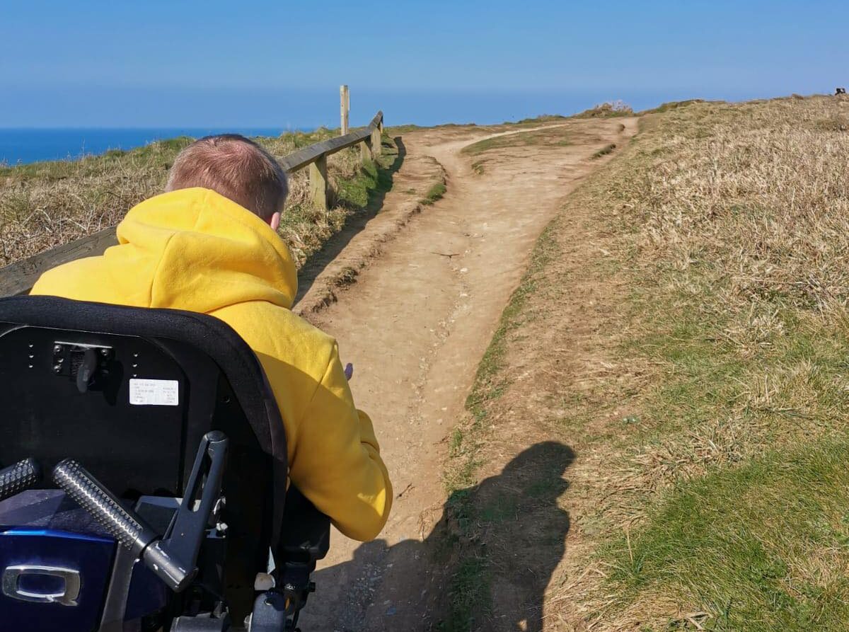 Access Cornwall volunteer Nick Carr explores a coastal path near Levant Mine in West Cornwall