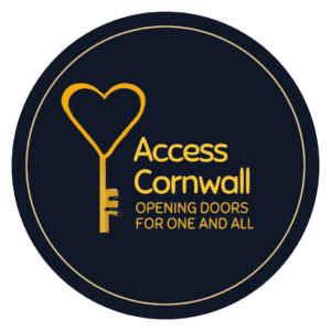 A round black car sticker with the Access Cornwall symbol, a key with a heart, and the words Access Cornwall, opening doors for one and all in gold.