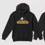 Black hoodie with the words I don't read words I remix them and the silhouette of a DJ above. The design is on the front of the hoodie.