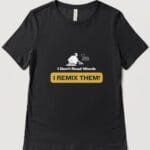 A black T shirt with the logo: I don't read words...I remix them with an outline of a DJ mixing records and the Access Cornwall logo discreetly beneath