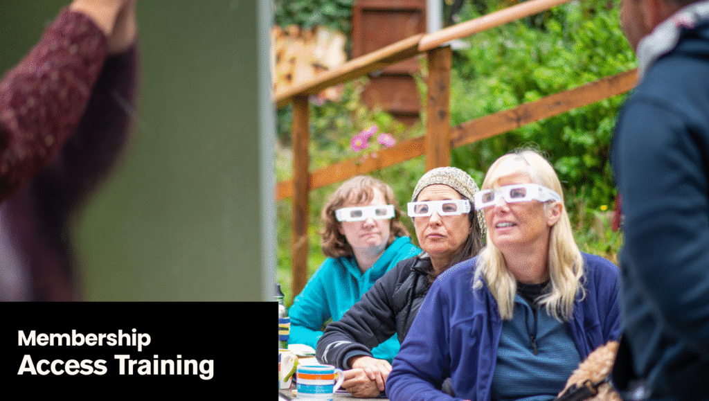 An image of trainees at an Access Cornwall accessibility training session. Three women are facing the camera, looking at a board as they wear vision impairment goggles. The text on the image says: Membership: Access Training.
