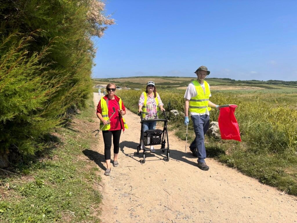 Our volunteer uses a rollator at our recent beach clean. She is with another volunteer and one of the Lizard National Trust team.