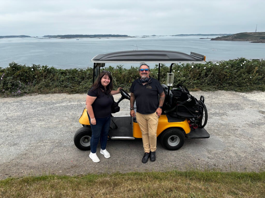 Matt and Viki with their Scilly Cart at Garrison with views towards Bryher and Tresco islands.