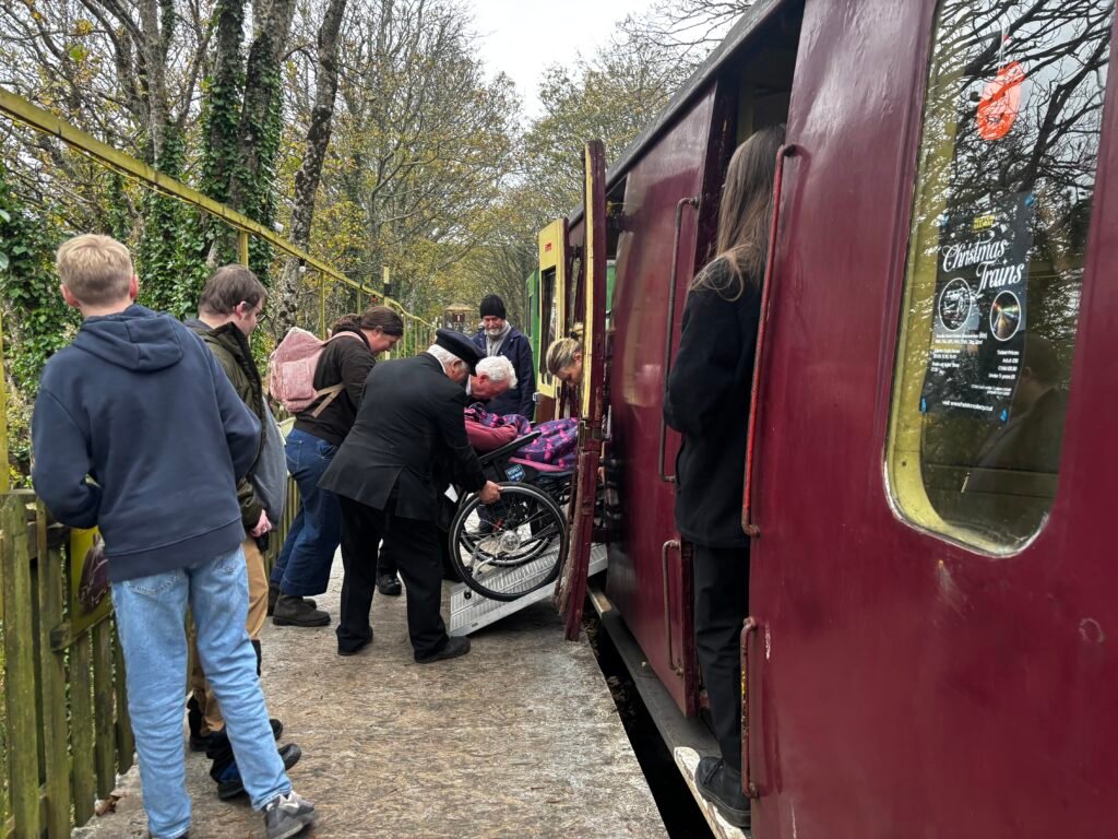 Holly our volunteer getting on to the accessible carriage